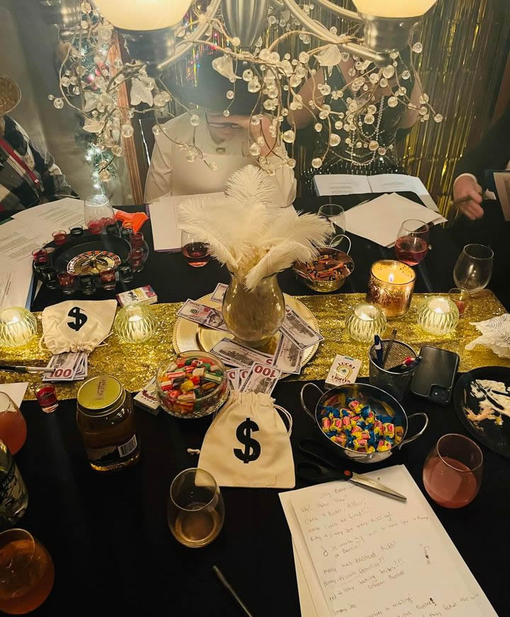 1920s black and gold tablescape mixed elegance with a shot roulette wheel and 'money'