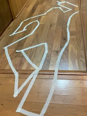 Outline of a body created using making tape