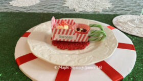 Candy cane sleigh place card with runners and chocolate petit fours