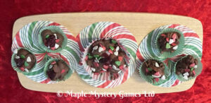 Miniature cakes with red, white and green XMAS tree sprinkles