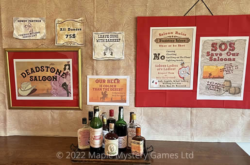 Deadstone Saloon - sign, posters and bottles with different labels from party pack