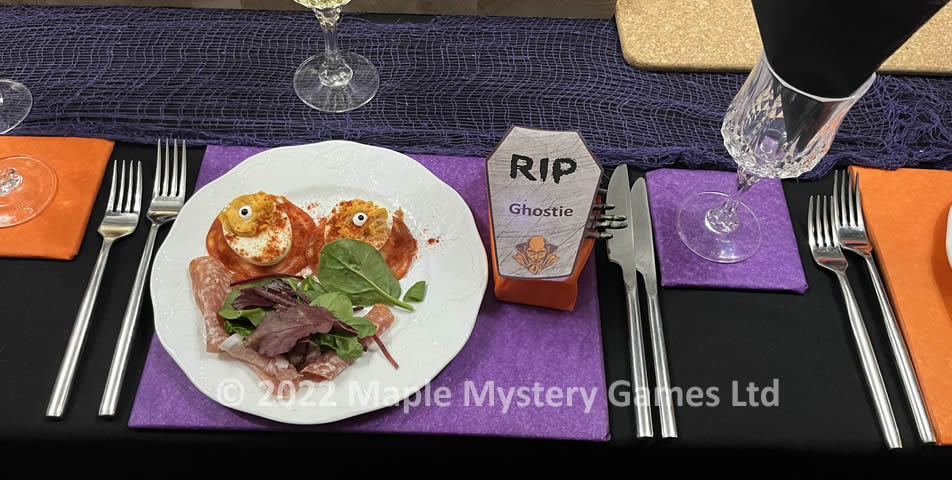 Dervilled eggs and coffin place setting