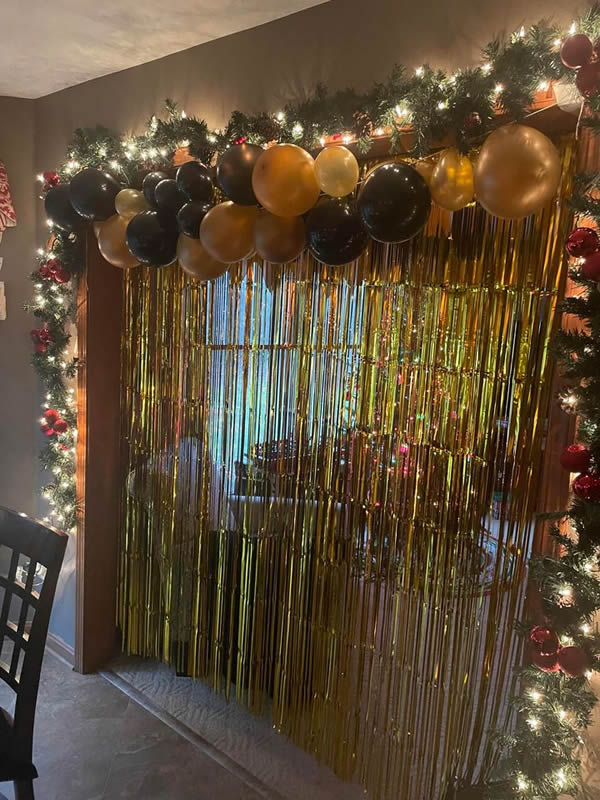 Gold ballons and foil curtains