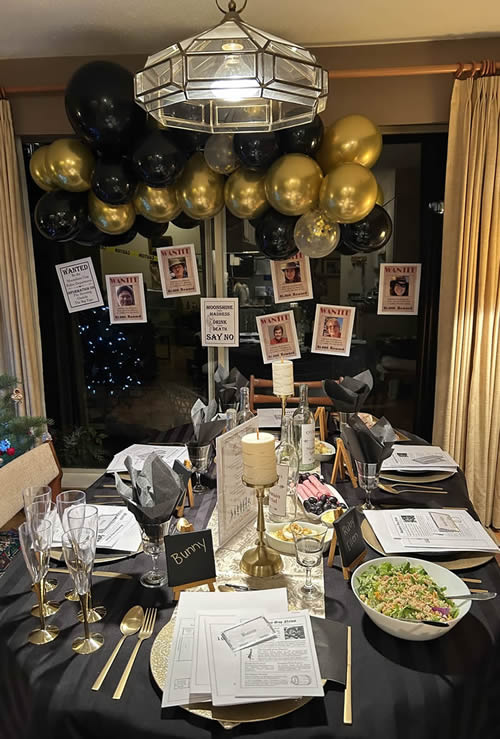 Black and gold tablescape with balloons