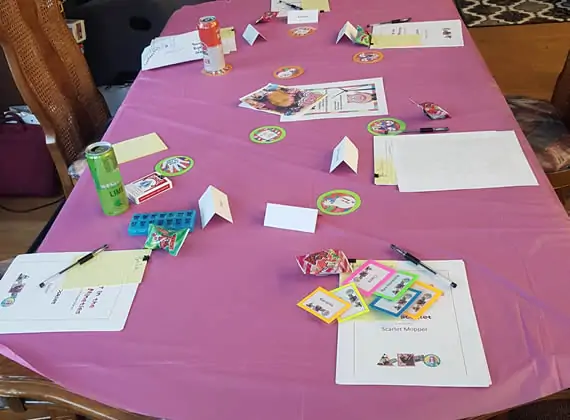 Bright pink tablecloth with neon-backed coasters