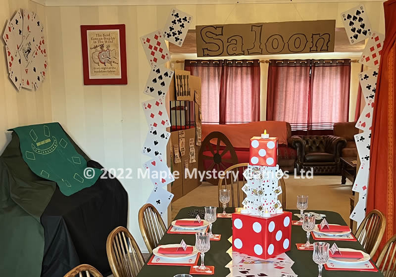 Playing cards decorate the saloon entrance betweent he lounge and dining room; cards also form an effective wall decor