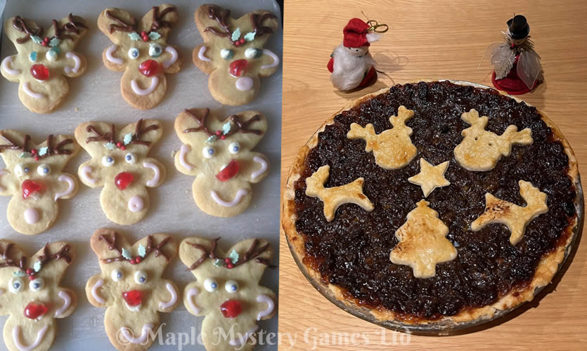 Reindeer shaped cookies and mince pie topped with reindeer, a star and a Christmas tree cut into pastry shapes