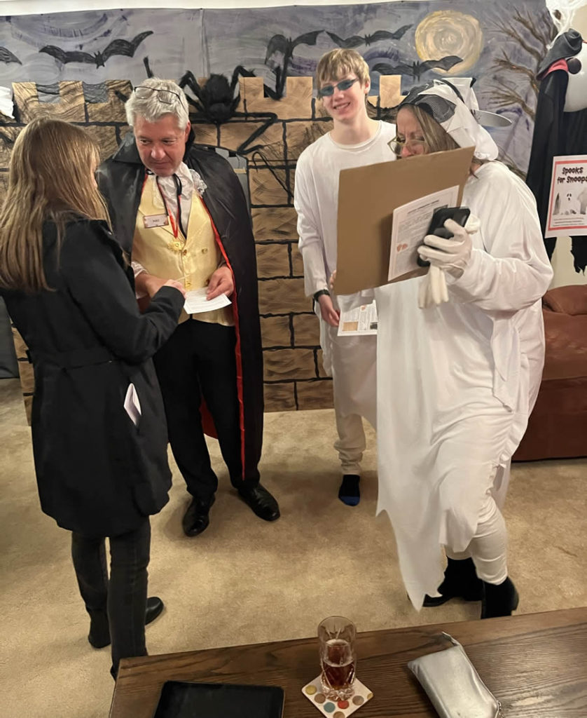 Spookie and Ghostie seek signatures on a "Rights for Ghosts" petition; Bea Eville offers a reading with her Diviner Cards