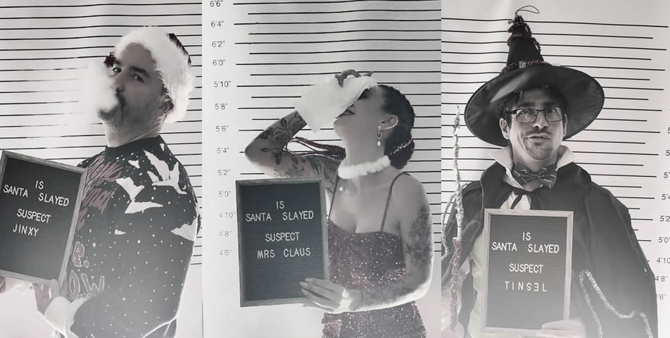 Some 'Is Santa Slayed?' suspects with a police mugshot backdrop