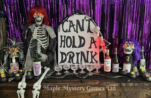 Spooky party decorations - bar area shows skeleton, skulls and a cardboard gravestone