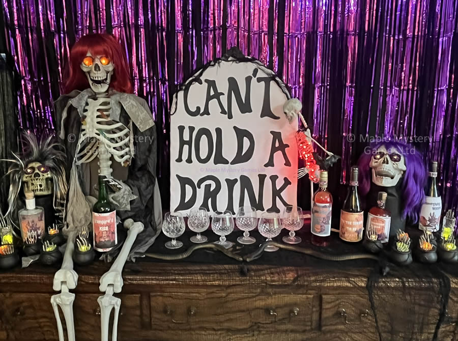 Skeletons, skulls and a gravestone for horror party decor