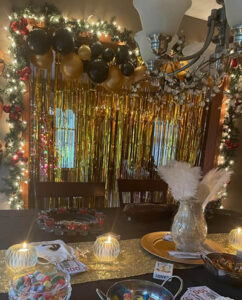 Stacy's stunning decorations combine festive baubles, tinsel and fairy lights with gold and black 1920s elegance.