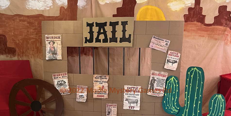 Wild West jail - made out of cardboard, with a wooden frame and metal bars