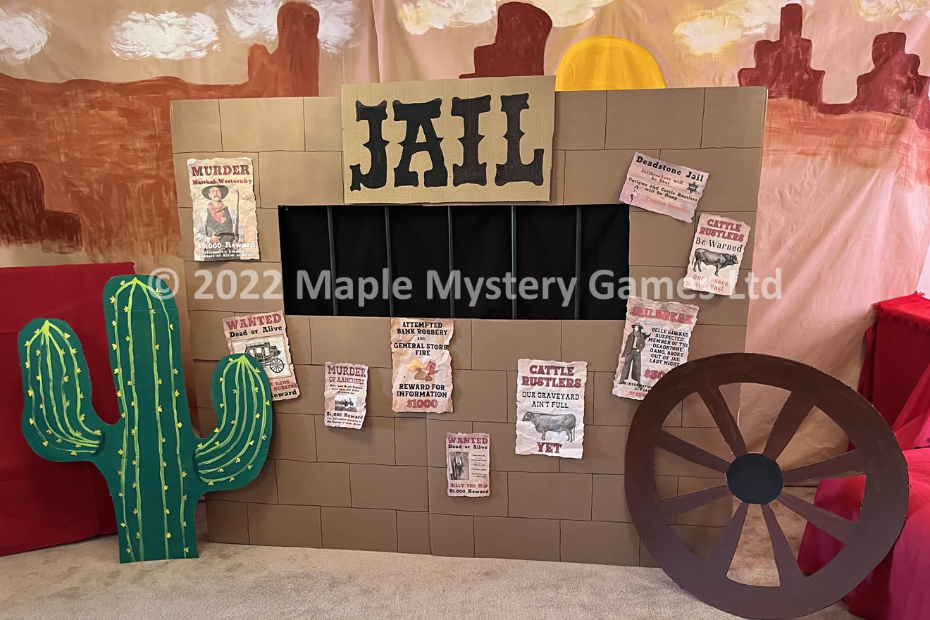 Pur Wild West jail, complete with wagon wheel and cactus and painted backdrop